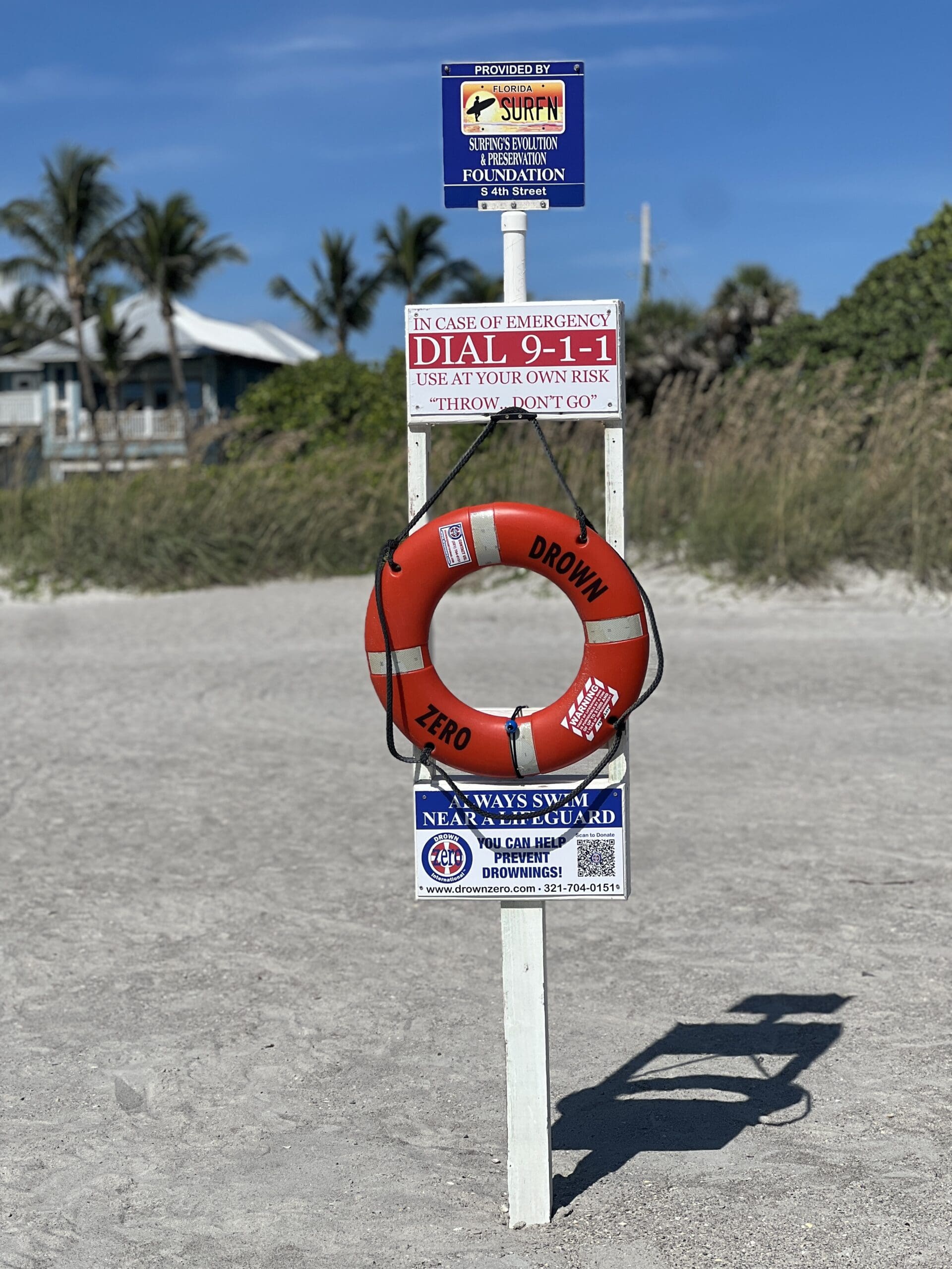Drown Zero floatation device stand at beach