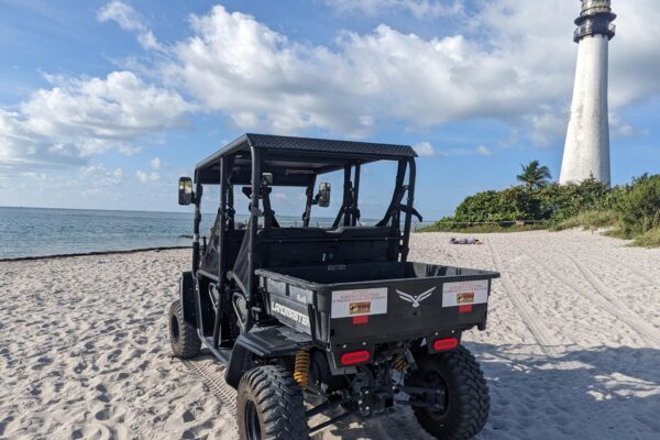 donated UTV at Bill Baggs on the beach with a lighthouse and ocean in the background