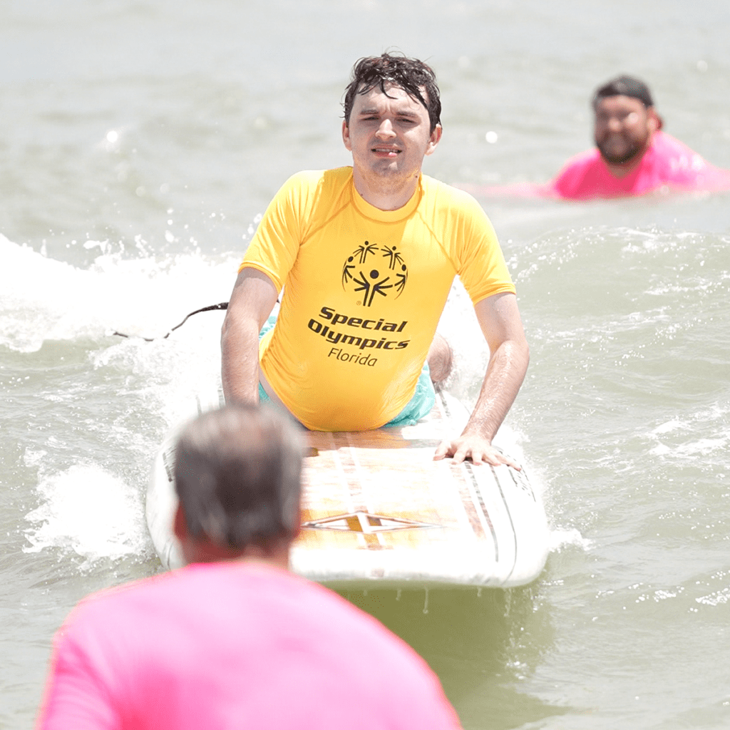 Special Olympics Florida athlete on surfboard