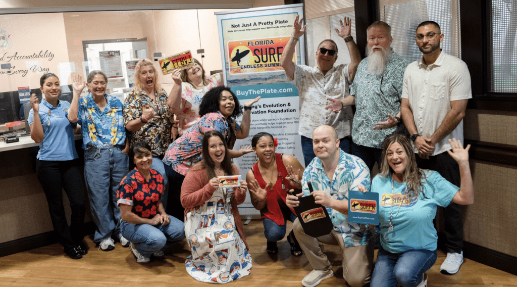 Group Shot of Brevard Tax Collector's Office Employees for promotion of Endless Summer License Plate. 