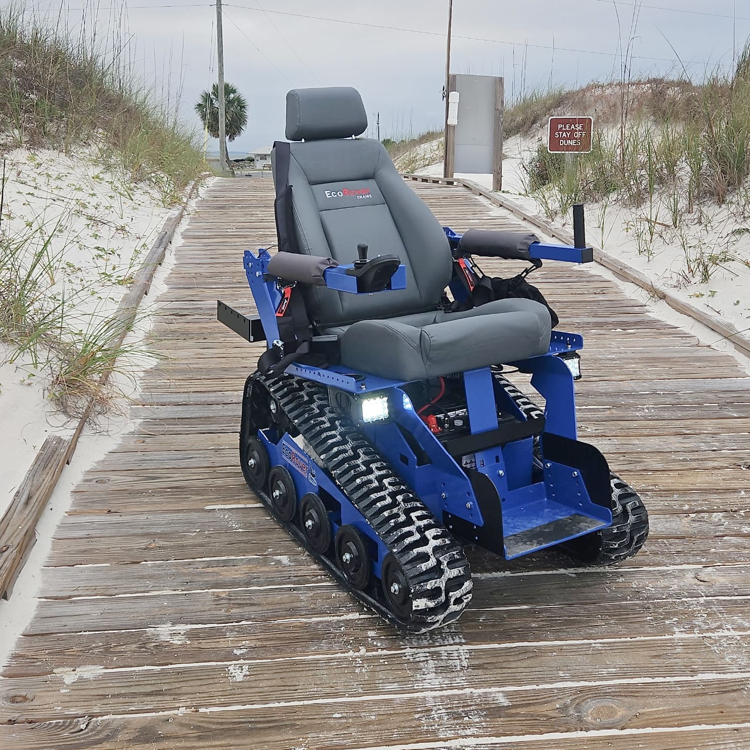 picture of eco-accessible wheelchair on beach access boardwalk